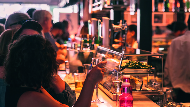 Customers eating foods at Mercado San Miguel Market in Madrid,Spain