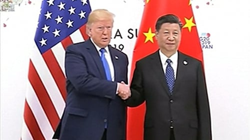 A presidential grip-and-grimace: Donald Trump and Xi Jinping frown for the cameras