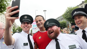 Taoiseach Leo Varadkar poses for a photo with PSNI officers ahead of the start of the parade