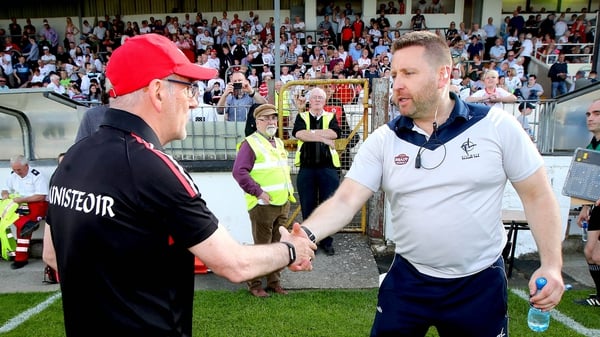 Cian O'Neill shakes hands with Mickey Harte after the game