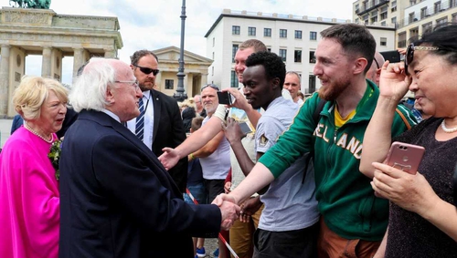 President Michael D Higgins greets well-wishers at the Brandenburg Gate in Berlin
