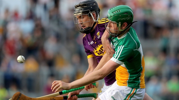Wexford's Conor Scallan battles with Brian Duignan of Offaly