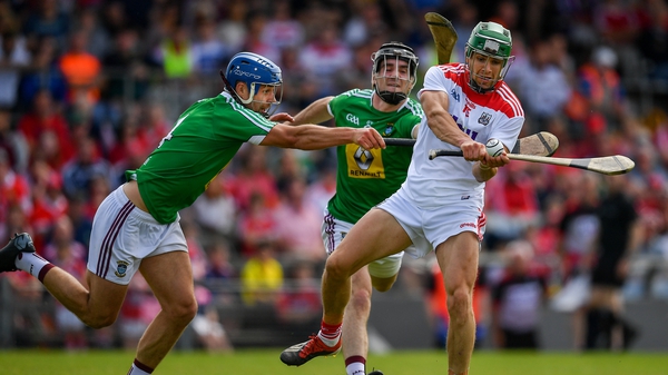 Alan Cadogan scores a point despite pressure from the Westmeath backs