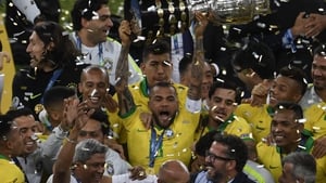 Brazil celebrate with the trophy after securing their ninth Copa America win
