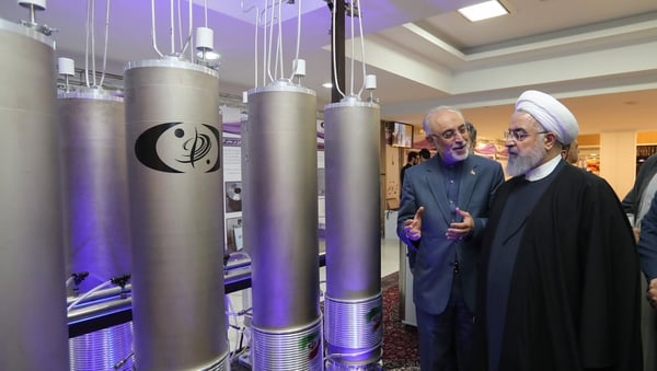 File image of President Hassan Rouhani (R) inspecting nuclear technology