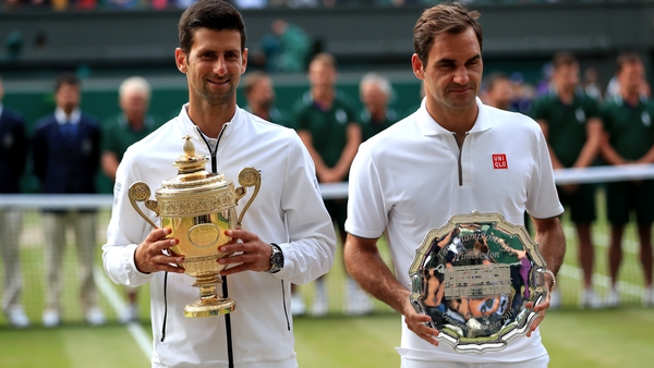 Djokovic (L) beat Federer in last year's Wimbledon men's singles final, the longest in history