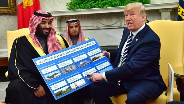 President Trump holds a defence sales chart with Saudi Arabia's Crown Prince Mohammed bin Salman at the White House
