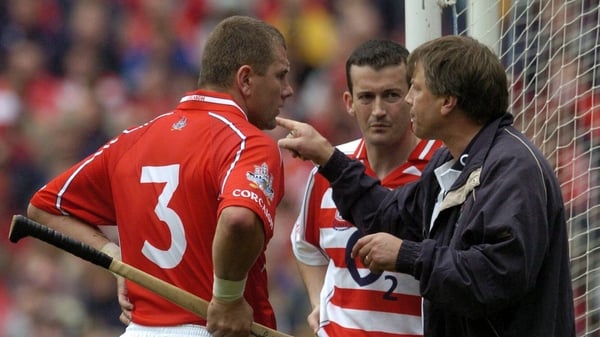 Sunday Game hurling pundit Donal Óg Cusack back when he was Cork goalkeeper alongside Diarmuid O'Sullivan and manager Donal O'Grady during the 2004 All Ireland final against Kilkenny
