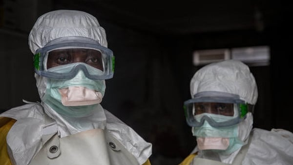 Medical staff in Goma wearing protective gear before entering an isolation area at an Ebola treatment centre