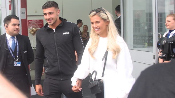 Love Island winners Amber Gill and Greg O'Shea and contestants Molly Mae  Hague and Tommy Fury (rear left to right) greet fans as they arrive at  Stansted Airport in Essex following the