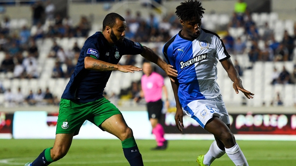 Roger Tamba M'Pinda of Apollon Limassol in action against Ethan Boyle of Shamrock Rovers
