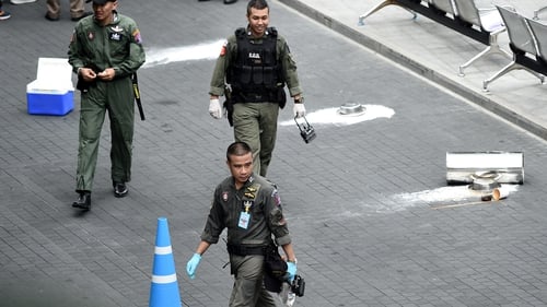 Thai bomb disposal experts at the scene of one of the blasts