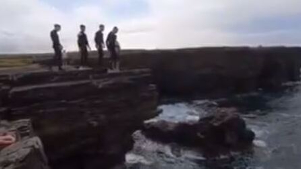 The video shows youngsters jumping from the steep cliffs