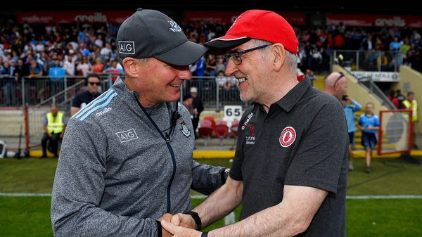 Jim Gavin, left, and Mickey Harte embrace after the full-time whistle in Healy Park