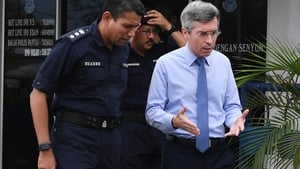 France's Ambassador to Malaysia Frederic Laplanche (r) meet the police coordinating the search operation