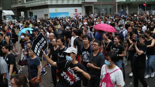 Several thousand teachers and their supporters have marched in Hong Kong