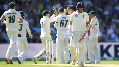 England's Rory Burns walks off after being caught out for nine runs off the bowling of Pat Cummins