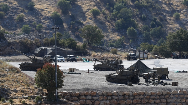 Israeli soldiers with their artillery unit deployed at the Israeli-Syrian border, in the Golan Heights