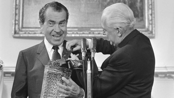 Irish Ambassador to the United States William Fay pins shamrocks on Richard Nixon's lapel on St Patrick's Day 1969 during an event at the White House in Washington. Photo: AP/US Embassy Dublin