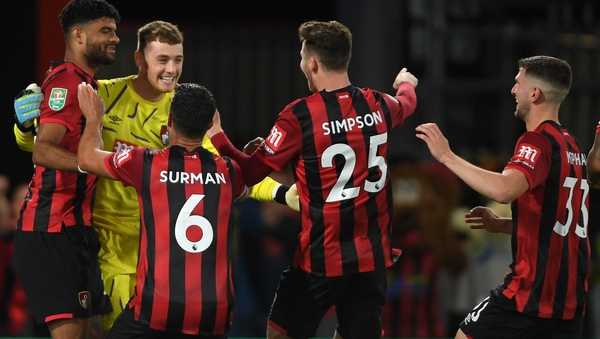 Mark Travers is mobbed by his Bournemouth team-mates