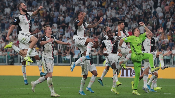 Juventus players celebrate after the final whistle