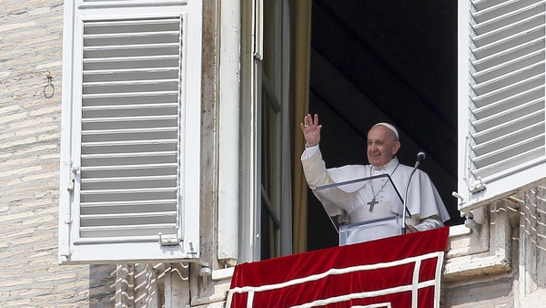 Pope Francis waves to the faithful in St Peter's Square