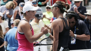 Ashleigh Barty shakes hands with Qiang Wang afterwards