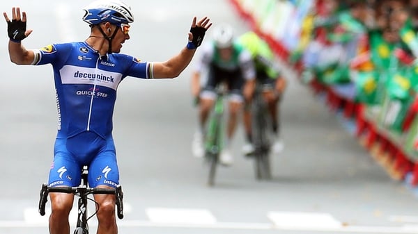 Philippe Gilbert looks back at his nearest pursuers as he crosses the line in Bilbao