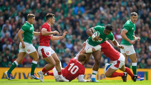 Ross Moriarty of Wales is tackled by Jean Kleyn, left, and Robbie Henshaw