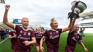Sarah Dervan, left, Shauna Healy, centre, and Niamh Kilkenny celebrate with the cup
