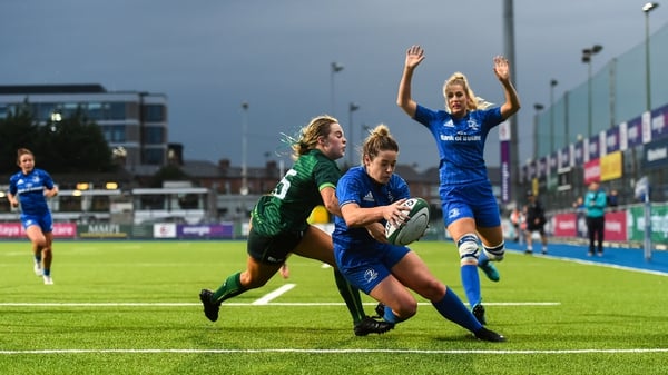 Grace Miller scores Leinster's third try despite being tackled by Beibhinn Parsons of Connacht