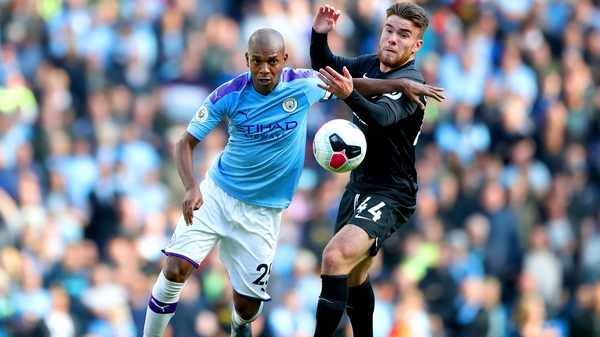 Aaron Connolly (R) in action against Manchester City's Fernandinho last month