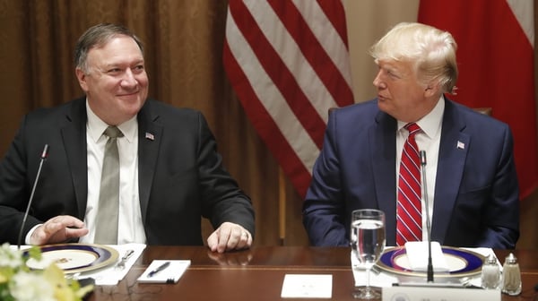 Mike Pompeo (L) has been given one week to produce documents relating to Ukraine