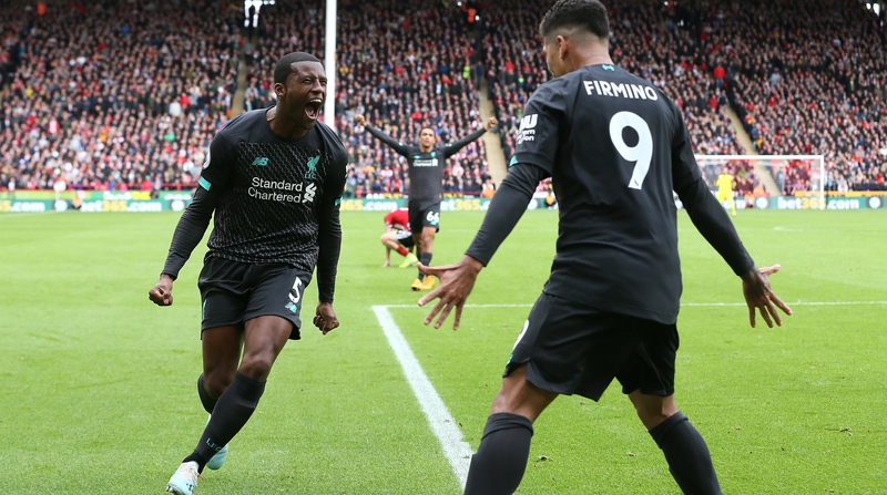 Liverpool's Georginio Wijnaldum celebrates scoring  with team-mate Roberto Firmino