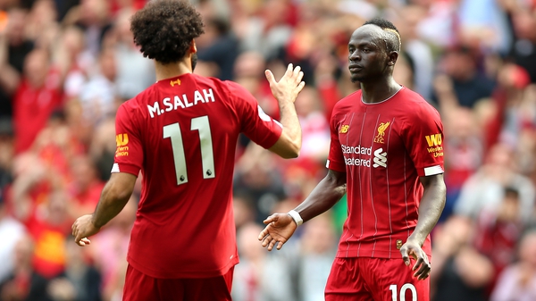 Sadio Mane (R) and team-mate Mohamed Salah