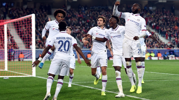 Willian leaps into the arms of Callum Hudson-Odoi as he celebrates scoring what turned out to be the winner at Stade Pierre-Mauroy