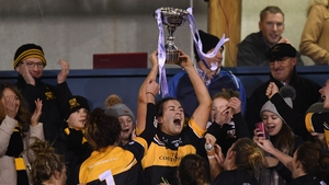 Bríd O'Sullivan lifts the Dolores Tyrrell Memorial Cup