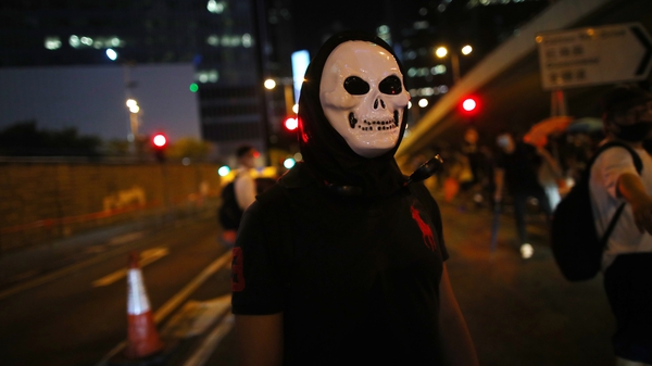 A protester wearing a skull mask in defiance of the ban