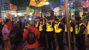 Gardaí created a barrier between environmental activists and the gates of Leinster House to allow politicians to leave