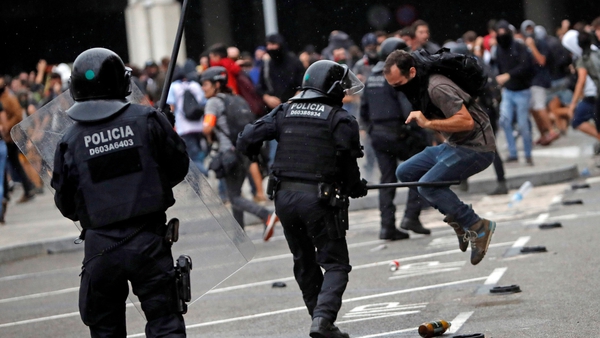 Demonstrators clash with police officers outside Barcelona-El Prat international airport