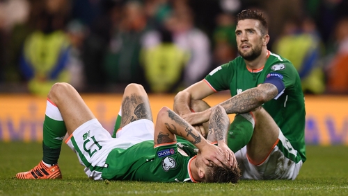 A dejected Shane Duffy sits on the Aviva Stadium turf after the 2017 hammering at the hands of Denmark
