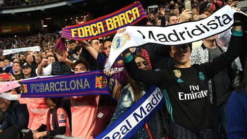 Fans from both clubs show their colours at El Clasico at Estadio Santiago Bernabeu last March