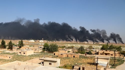 Smoke clouds rising from scene of clashes between the SDF and Turkish troops in northeastern Syria