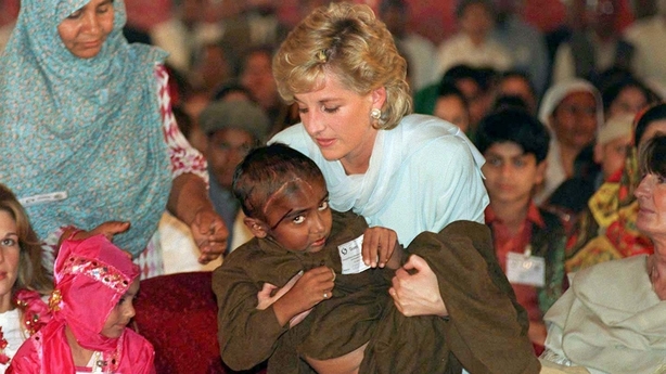 Diana cradles a sick child during a visit to Pakistan in 1996 (John Giles/PA)