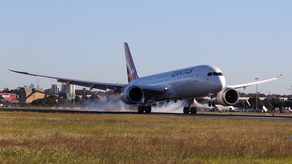 The Qantas Boeing 787 passenger plane lands at Sydney International Airport after finishing a flight from New York