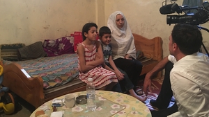 Elham with two of her children who live in the Shatila refugee camp on the outskirts of Beirut