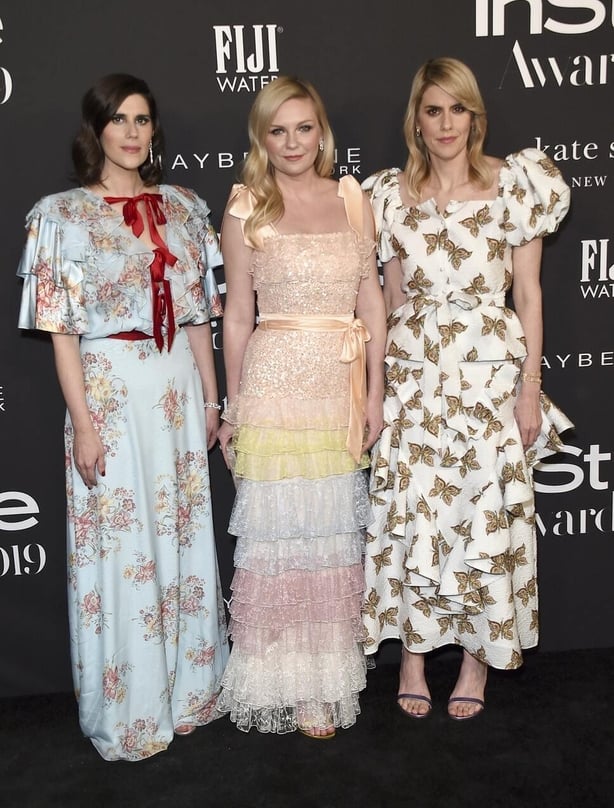 Kirsten Dunst, centre, and Rodarte designers Laura Mulleavy, left, and Kate Mulleavy at the InStyle Awards (Jordan Strauss/AP)