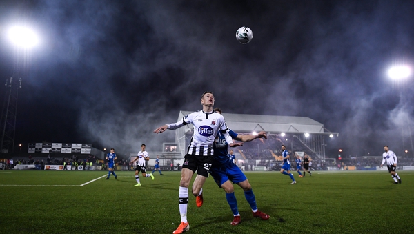 Daniel Kelly of Dundalk and Dean Clarke battle for the ball