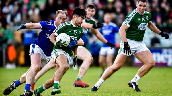 Naoise O'Baoill of Gaoth Dobhair in action against Anthony Thompson of Naomh Conaill