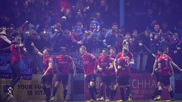 Chris Lyons of Drogheda United, extreme right, celebrates with team-mates and supporters